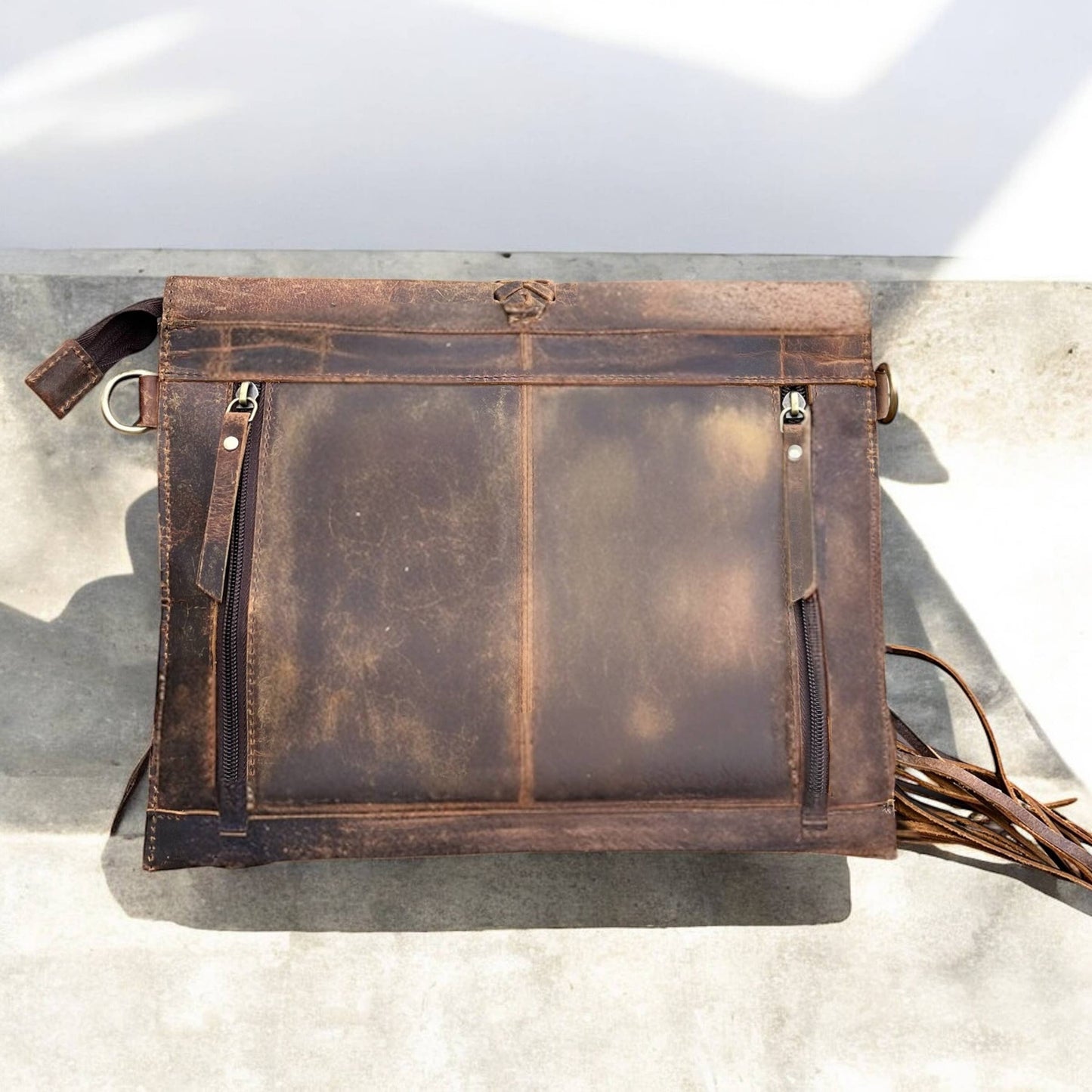 Rustic leather fringe crossbody bag