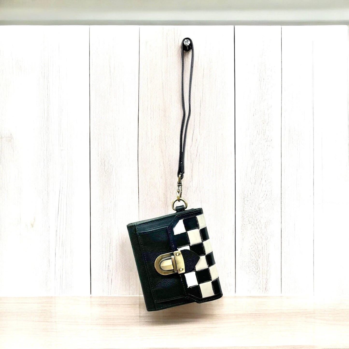 Checker tooled leather wristlet wallet