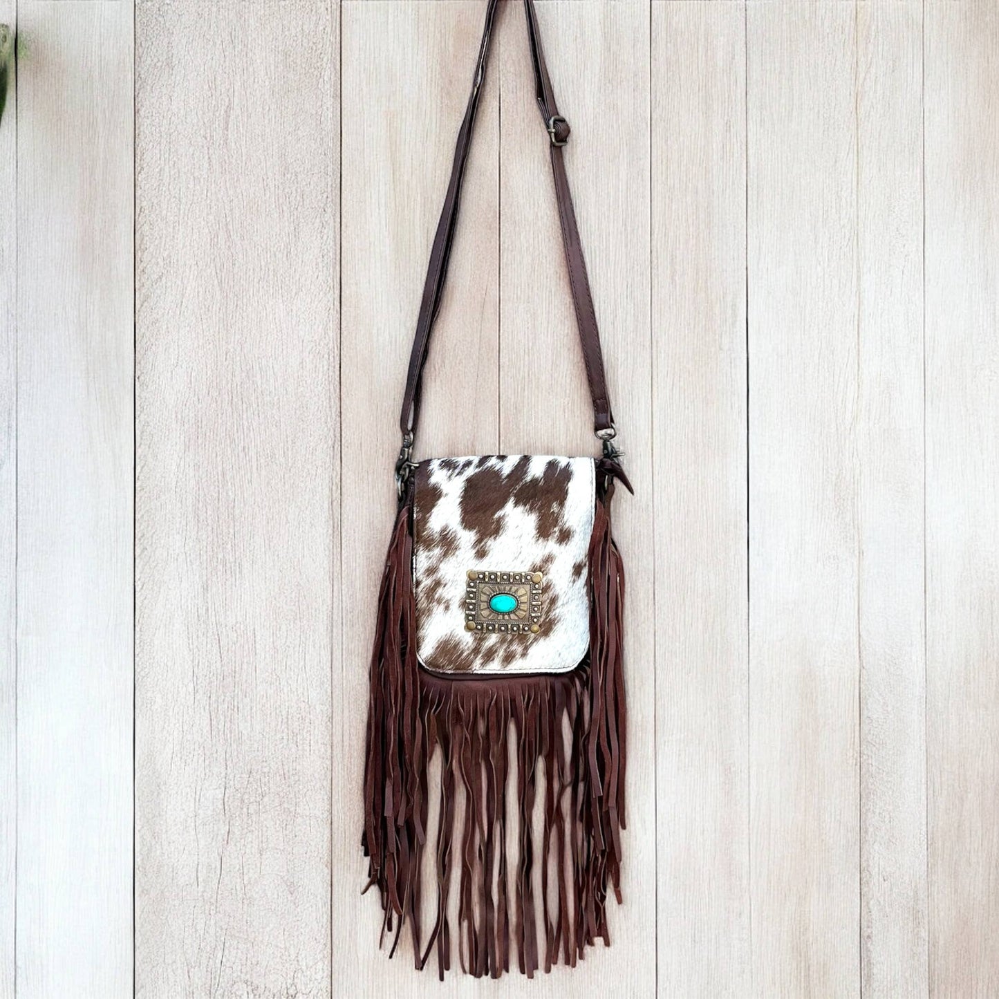 Cowhide conch fringe crossbody bag