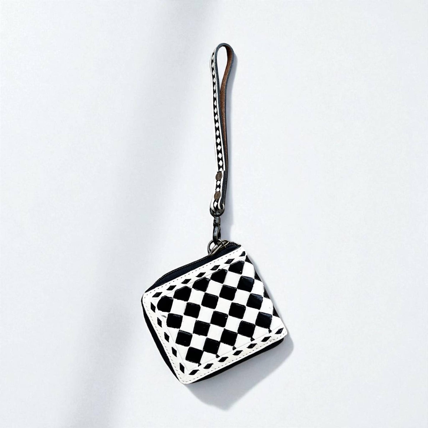 Checker tooled leather wristlet 