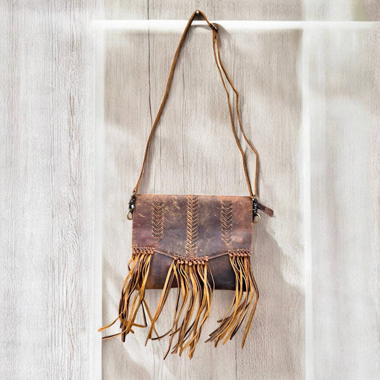 Rustic leather fringe crossbody bag 