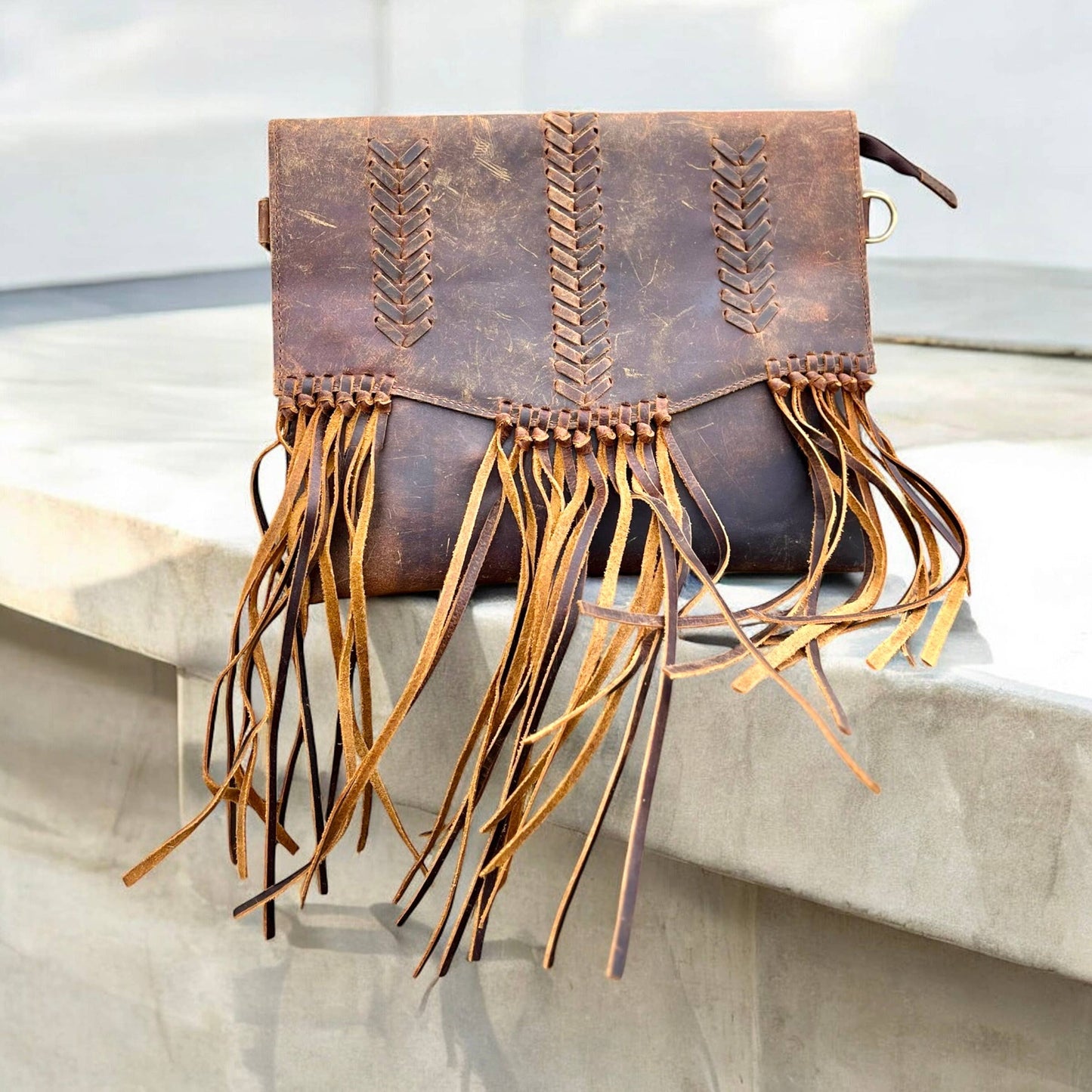 Rustic leather fringe crossbody bag 