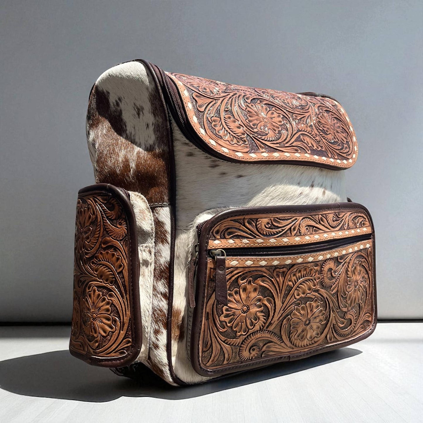 Brown tooled leather & cowhide backpack 